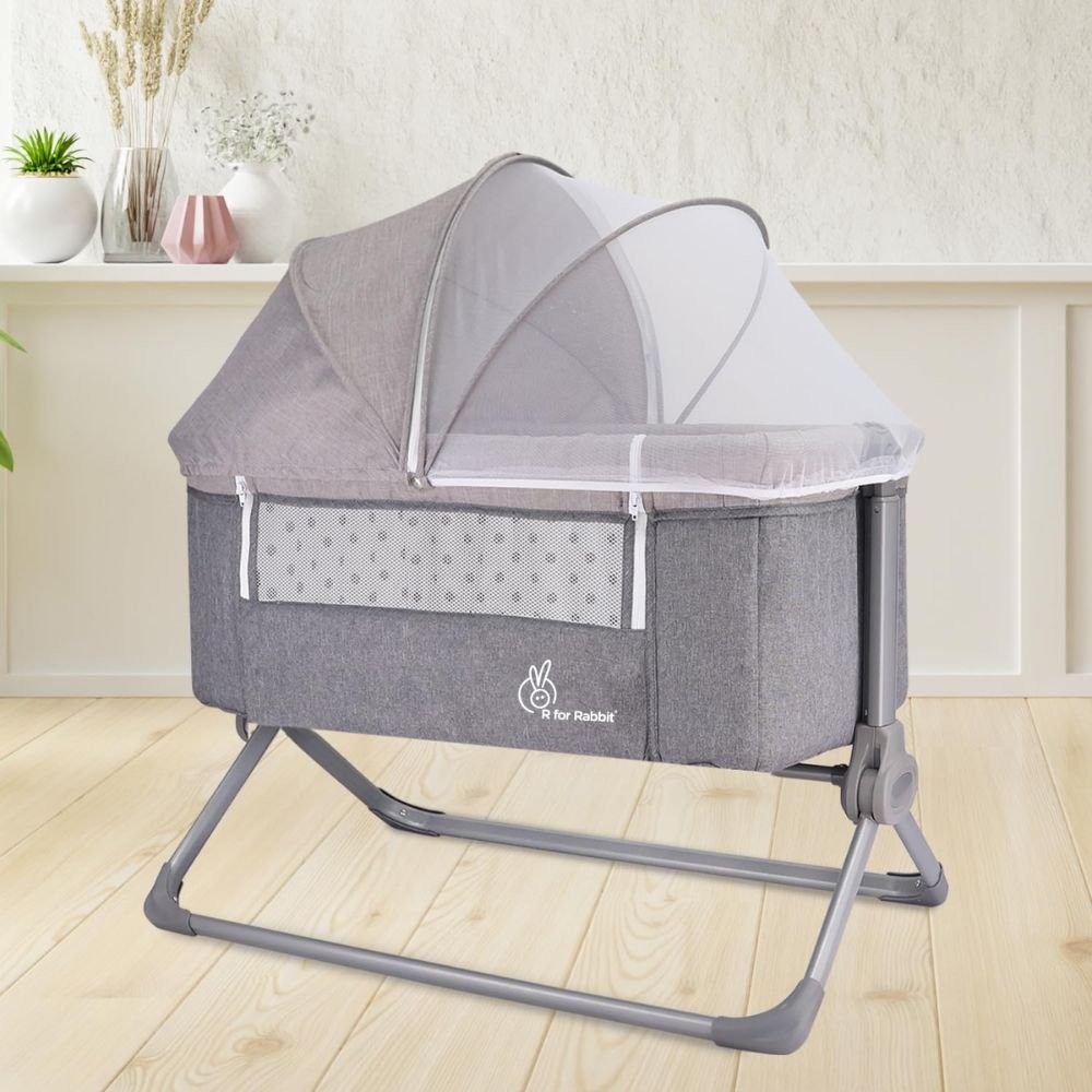 R for Rabbit Lullabies Baby Bassinet Bedside Sleeper with Adjustable Height Breathable Mesh Mosquito Net Lockable Wheels Storage Basket for 0 to 6 Months